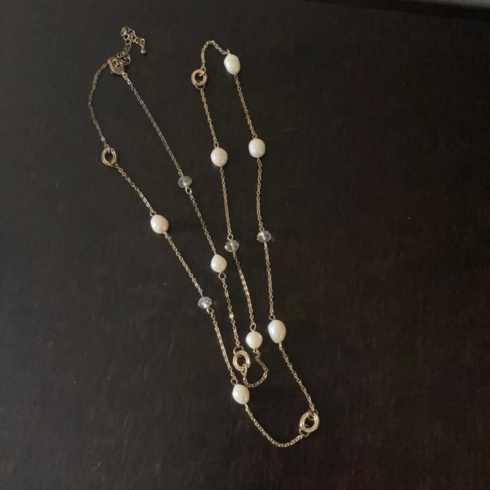 Long gold necklace with crystals and faux pearls